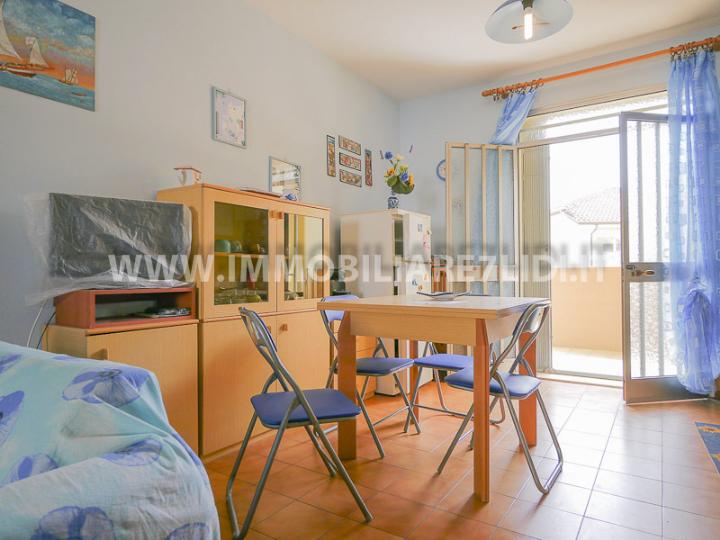 soggiorno con angolo cottura