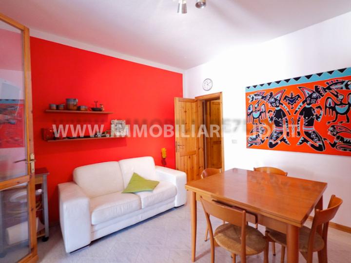 soggiorno con angolo cottura