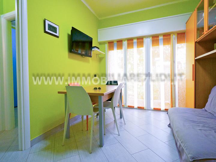 soggiorno con angolo cottura