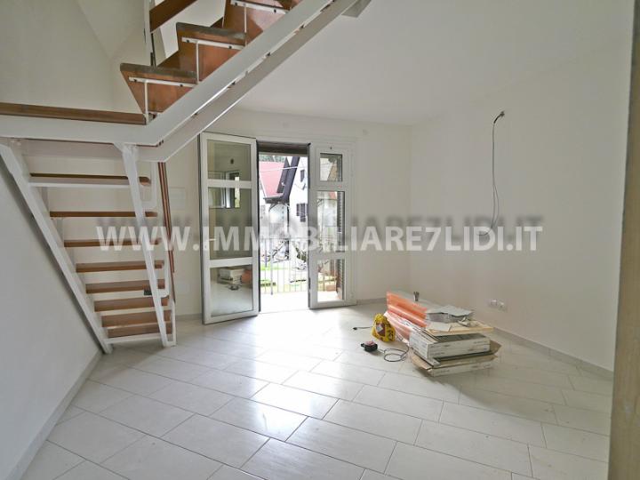 soggiorno con angolo cottura