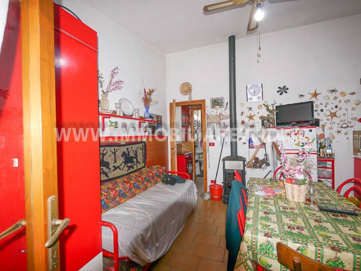 soggiorno con angolo cottura