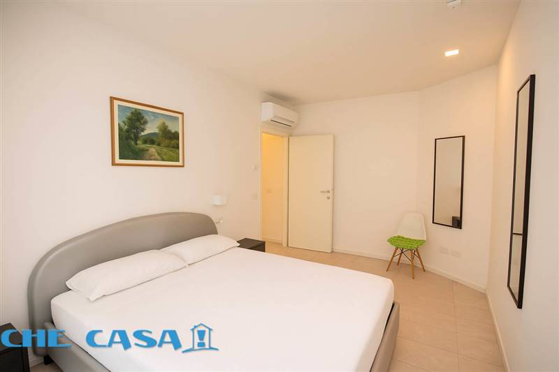 Camera da letto minimalista moderna.jpg